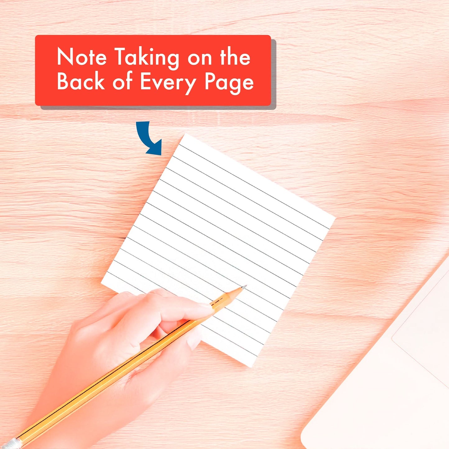 A hand writes on the back of a lined notepad page. Above, text says "Note Taking on the Back of Every Page." On the right, a PRE-ORDER 2026 Daily Dad Joke Desktop Calendar by That Is So Dad and a laptop are partly visible.