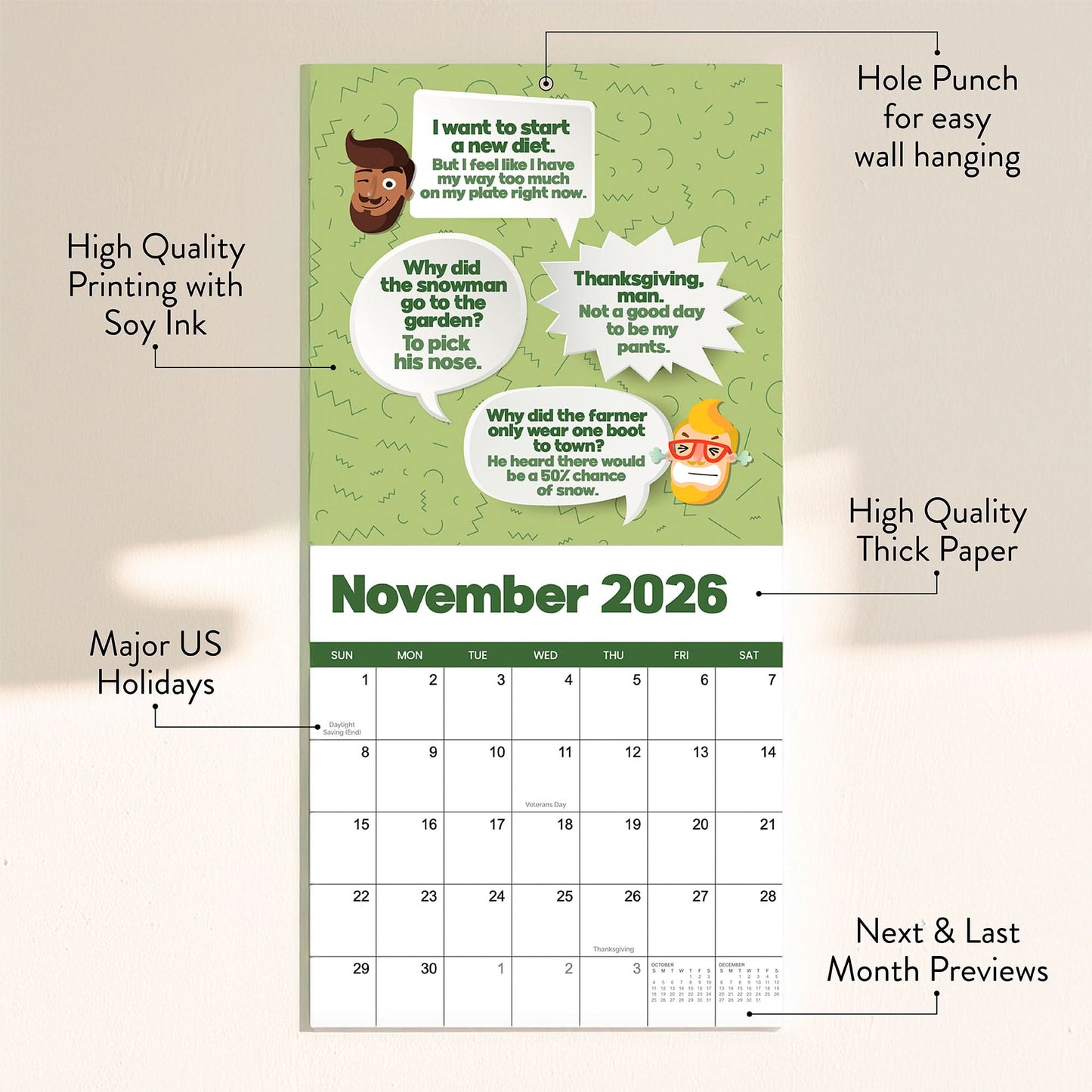 The 2026 Dad Joke Wall Calendar by That Is So Dad showcases a November page with illustrated joke speech bubbles, labeled features, and clearly marked holidays, all on a neutral background.