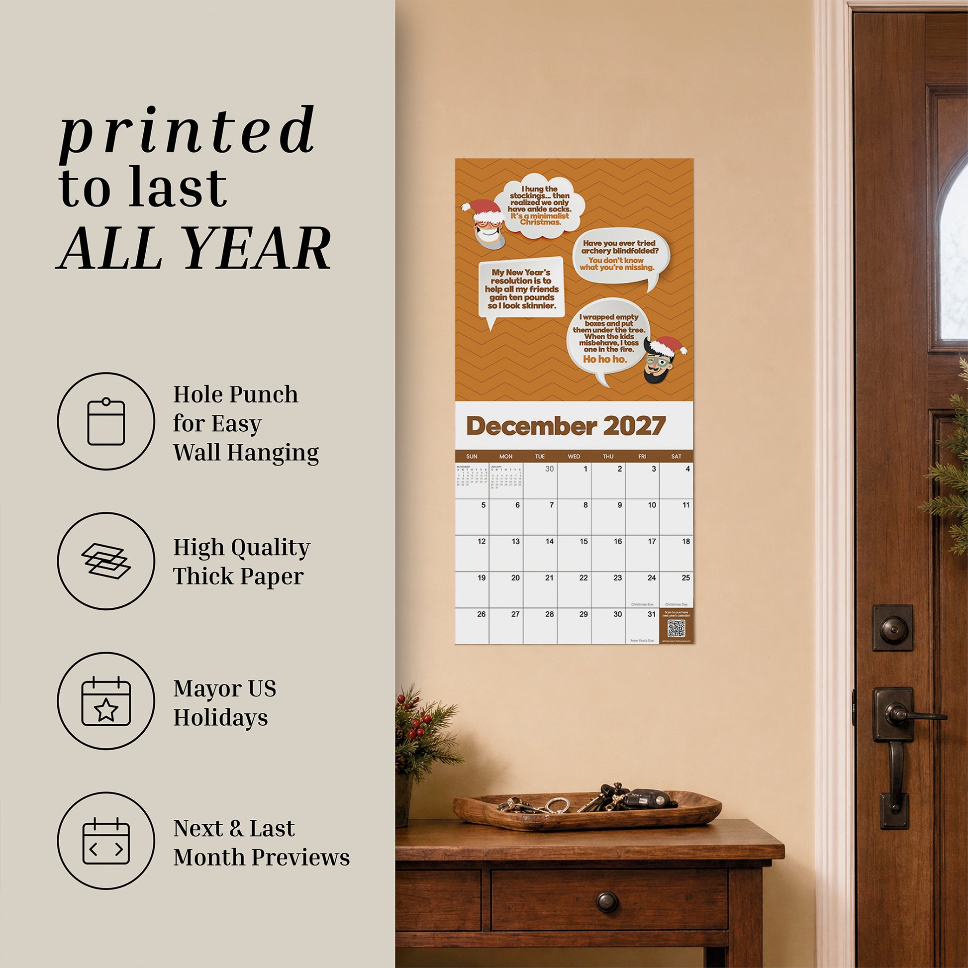 A 2027 Dad Joke Wall Calendar by That Is So Dad hangs by the door, with nearby icons showcasing its easy-hanging design, thick paper, coverage of major US holidays, and handy previews of the next and last months—all topped off with a brand-new dad joke each month to keep your year organized and full of laughs.