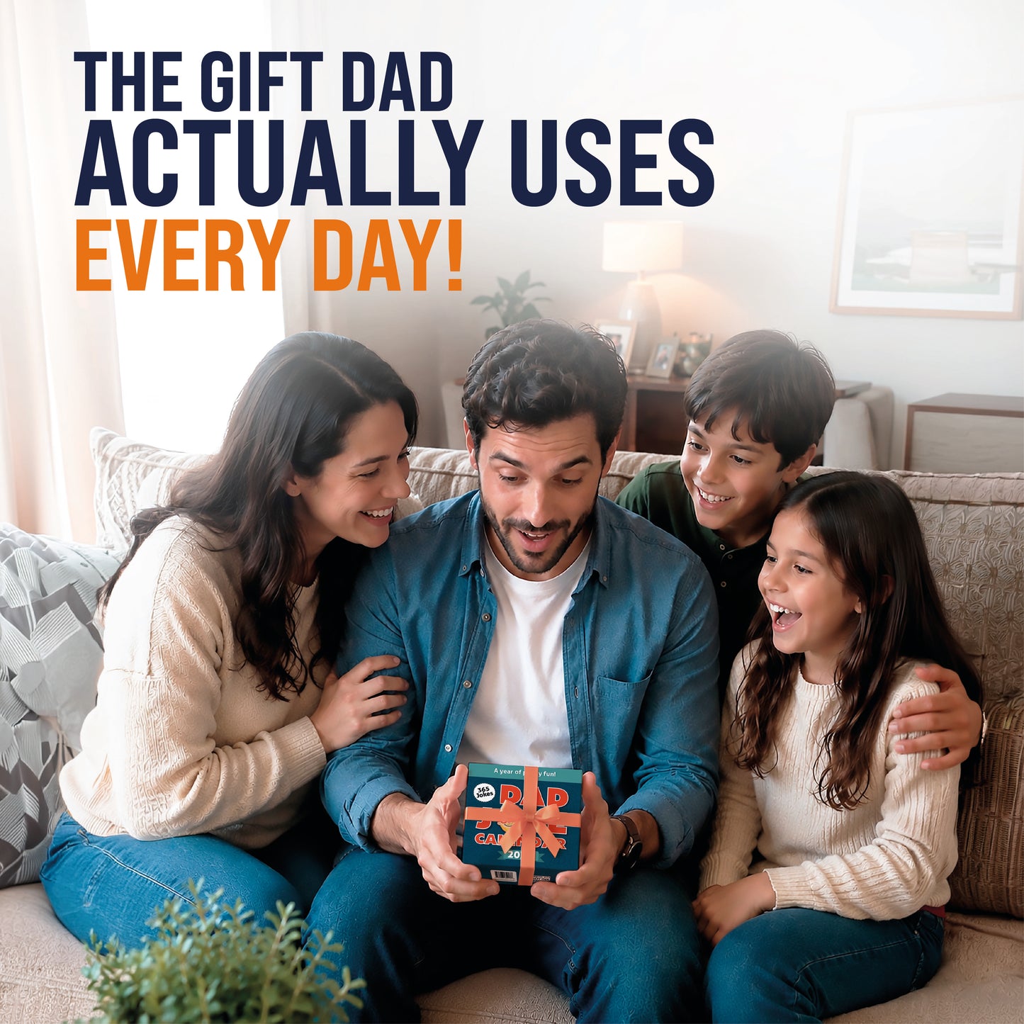 A man sits on a couch with a woman and two children, smiling as he holds a small wrapped gift. Text above reads, “The gift Dad actually uses every day—his new That Is So Dad 2027 Daily Dad Joke Desktop Calendar packed with hilarious dad jokes!”.