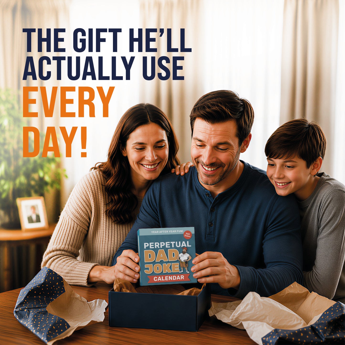 A man opens a gift box with a Perpetual Dad Joke Desktop Calendar from That Is So Dad. He smiles at the table with his family. Text: “The daily dad jokes desk gift he’ll actually use—by That Is So Dad!”.